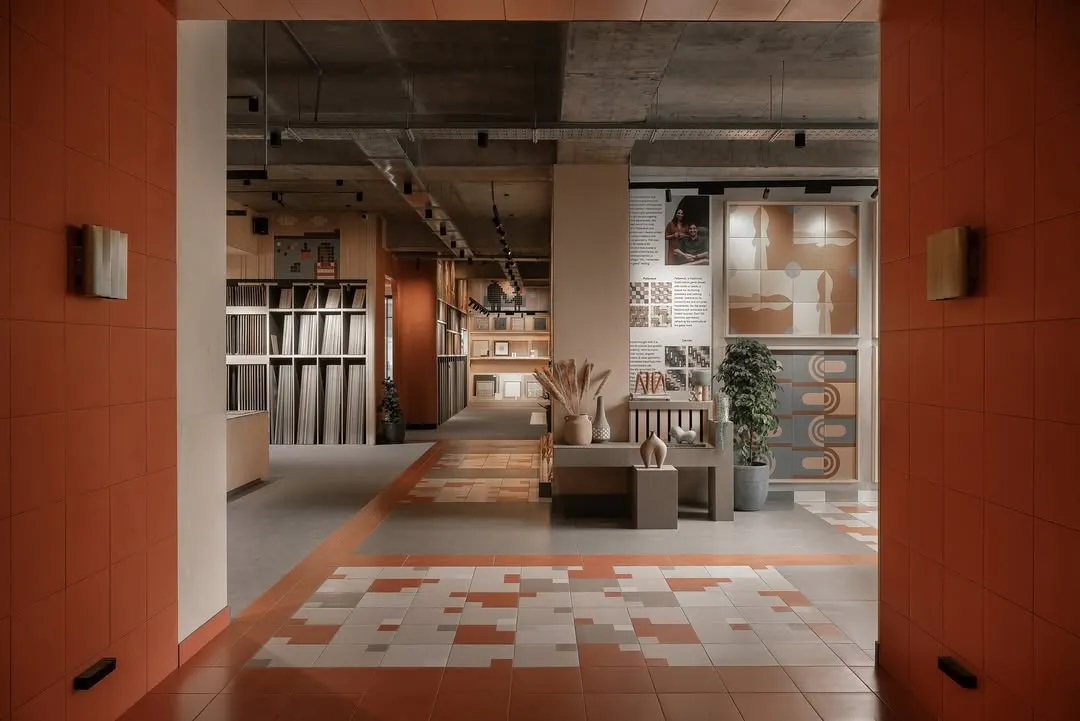 The entrance to the Trove experience center, a commercial space we designed from the ground up. We used warm terracotta tiles and carefully framed views to create a welcoming threshold, inviting visitors into a world of texture and pattern.