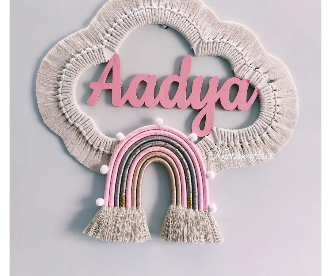 I absolutely love making these personalized macrame cloud and rainbow wall hangings. This piece for little Aadya was made with soft pinks and earthy tones, creating a dreamy and unique decoration for her nursery. I can customize the name, colors, and size to make it perfect for your child's room.