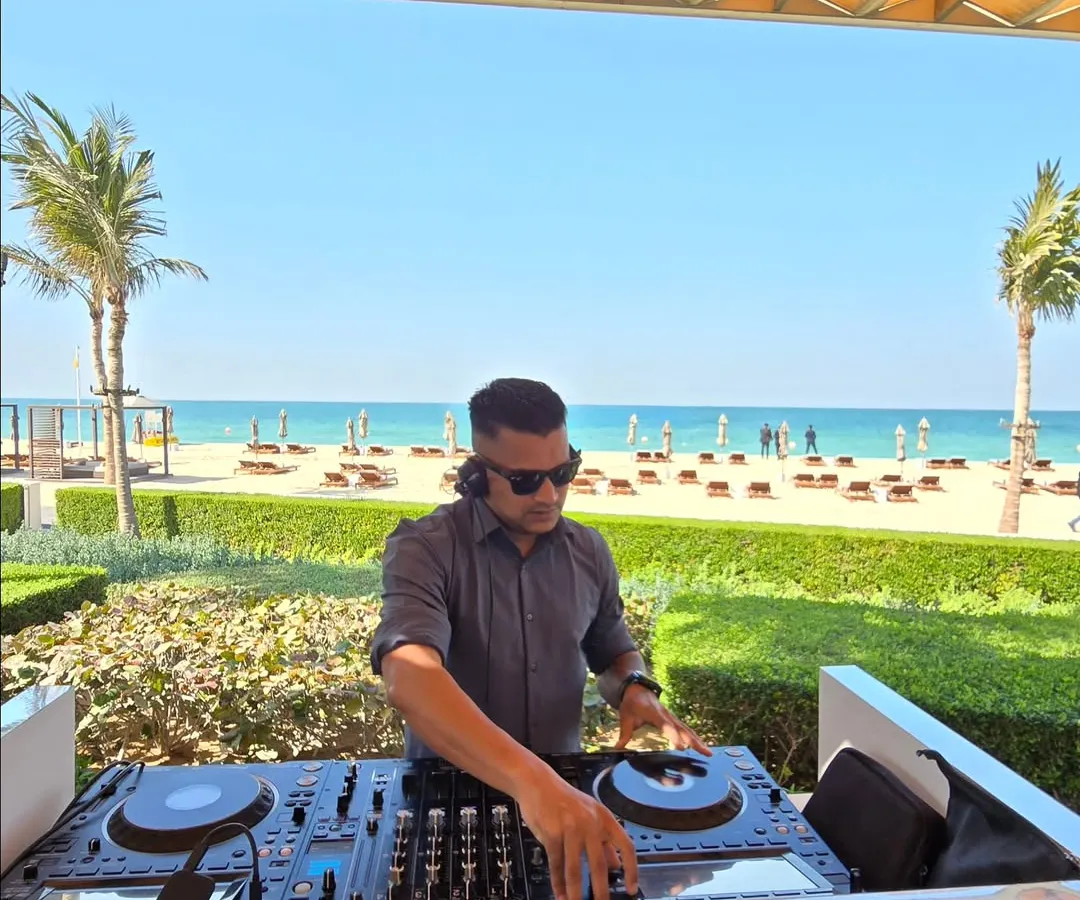 Setting the vibe for a beachside sundowner in Dubai. My work takes me to the most beautiful locations, and I specialize in creating the perfect soundtrack for any destination event, whether it's a relaxed brunch or a high-energy party.