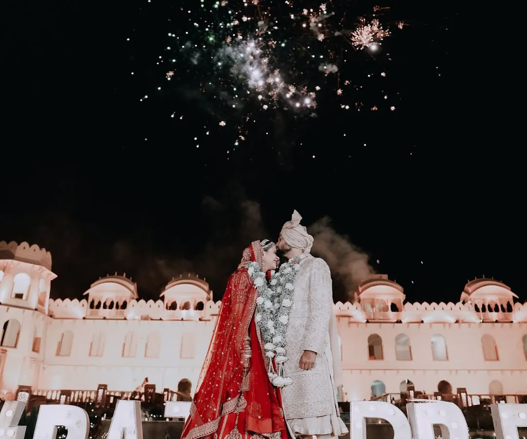 As fireworks light up the sky, two hearts become one. We specialize in capturing the grand scale and explosive joy of your celebrations, turning fleeting moments into epic memories against a palace backdrop.