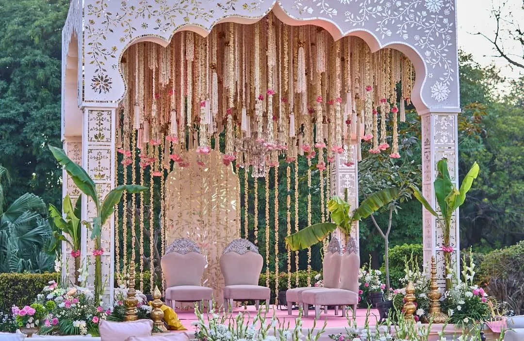I believe a mandap should feel like a sanctuary. For this ceremony, I designed a structure that felt both grand and intimate, with a waterfall of tuberose and roses descending from a hand-detailed arch, framed by sacred banana leaves to bless the union.