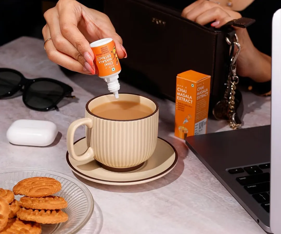 This lifestyle photo shows Sprig's Chai Masala Extract in a natural, everyday work setting. My goal here is to place the product directly into the customer's life, making it feel both aspirational and essential for their daily routine.