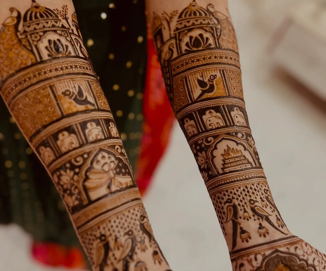 The beauty is in the details. I love creating full, symmetrical bridal designs that tell a story through intricate patterns, like the traditional jharokhas, birds, and sacred kalash motifs shown here.