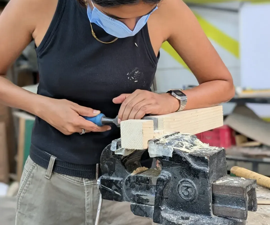 There's something special about using hand tools. It's a direct connection between you, the tool, and the wood. Here, a participant is carefully chiseling a joint, learning a skill that's been passed down for generations. It takes patience, but the result is so worth it.