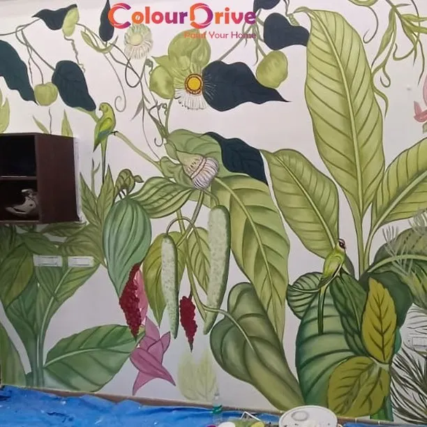 We brought this vibrant, tropical jungle to life with a completely freehand painted mural. This type of custom wall art allows for unparalleled creativity, turning a plain wall into a one of a kind masterpiece that reflects your personal style.