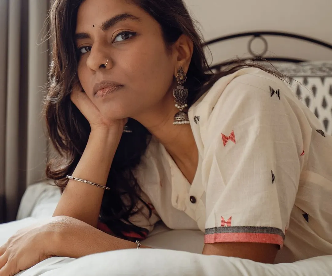 An intimate indoor portrait for a clothing brand, focusing on the model's direct gaze. This demonstrates how I create a personal connection and moody atmosphere even in a commercial lifestyle shoot.