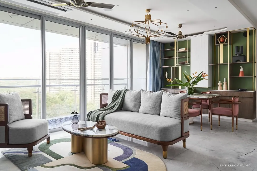 An expansive view of the Whimsical House, showcasing an open-plan living, dining, and kitchen area. I designed this space to feel bright, airy, and connected, using a playful color palette and custom furniture like the 'Ananta' center table to create a home that is both stylish and perfect for family life.