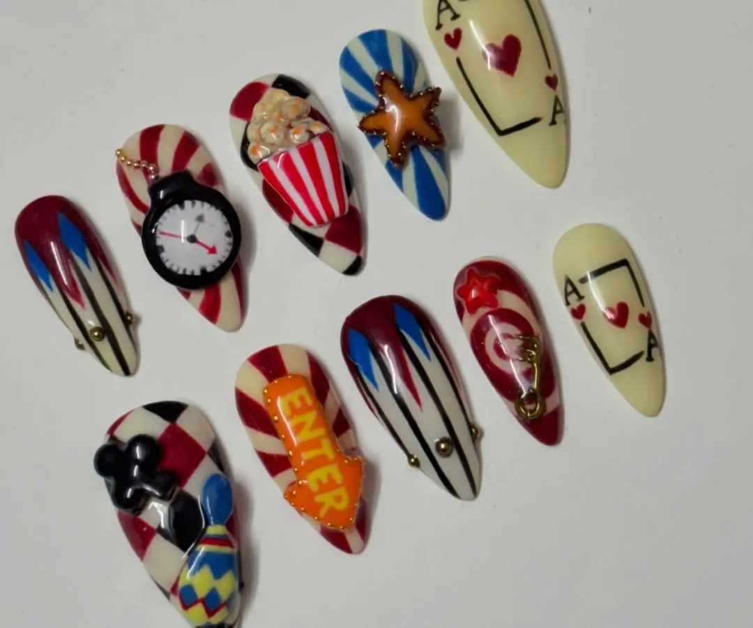 Feeling lucky? This casino themed set is all about high stakes and high fashion. I went all out with 3D details like a tiny popcorn bucket, a clock, and playing cards. It's a bold, maximalist design for when you want your nails to do all the talking.