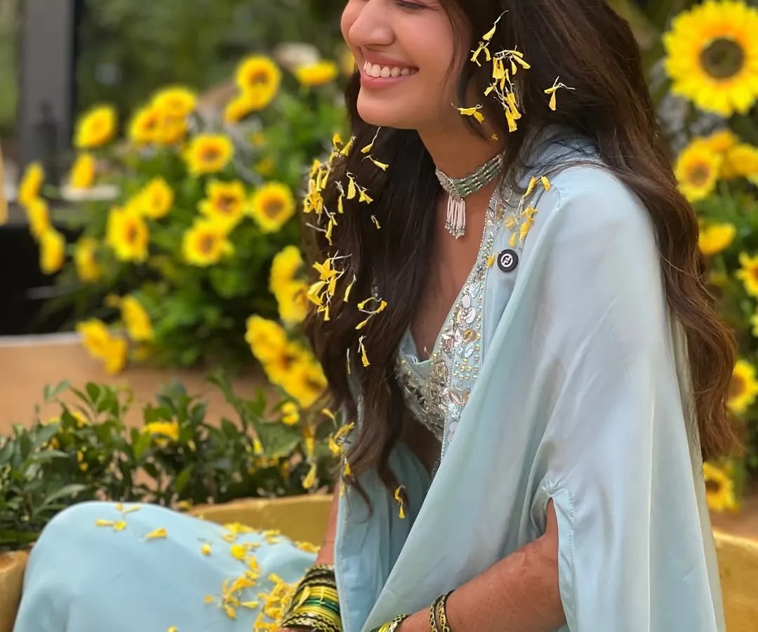 This picture is pure sunshine. My bride Serena during her Haldi in Goa, surrounded by marigolds and just radiating happiness. This is the kind of natural, joyful glow I love to create.