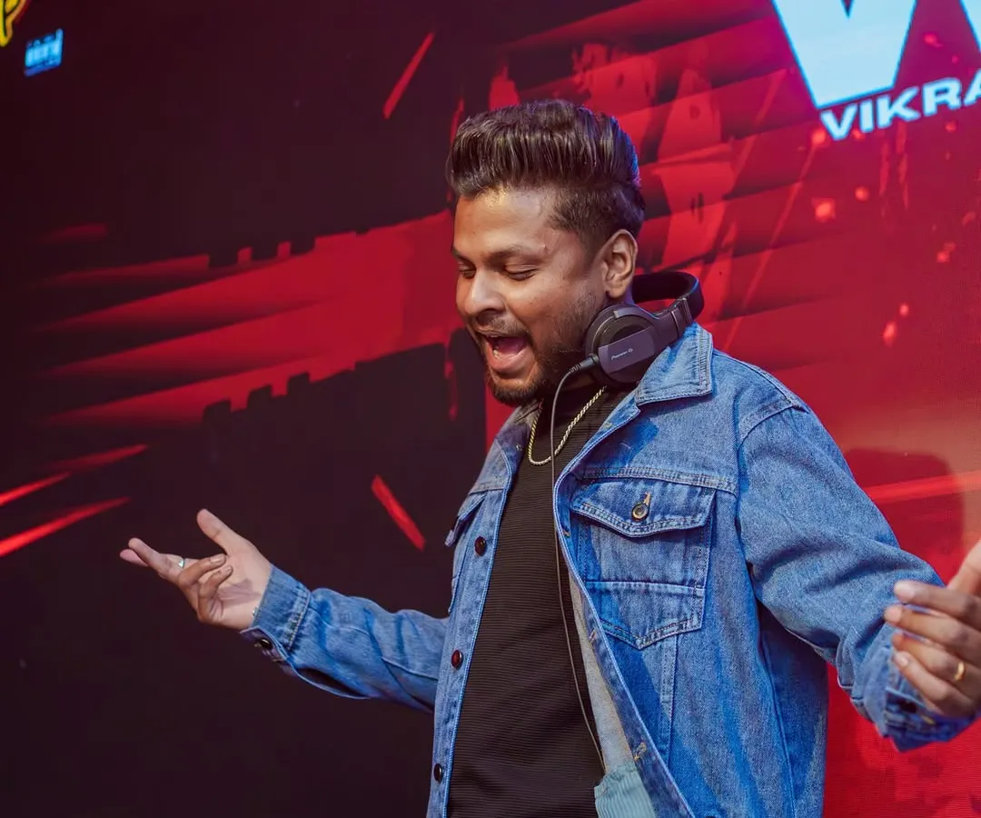 It's all about the connection. Here I am on the decks, getting on the mic to hype up the crowd at Happy Brew. An essential part of my job is reading the room and interacting with everyone to keep the party going.