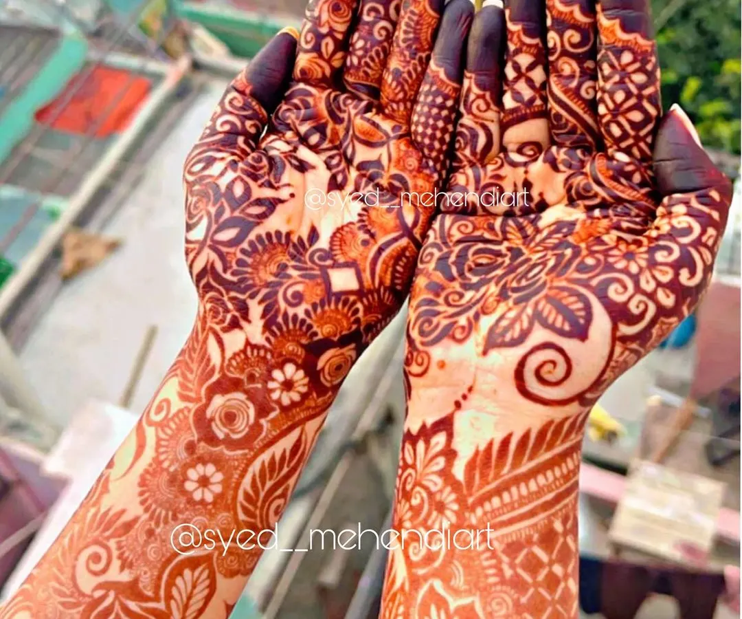The beautiful, deep reddish-brown stain of my natural henna paste, captured in the sunlight. This is the result after the paste has been removed, showing the quality and richness of color you can expect for your special day.