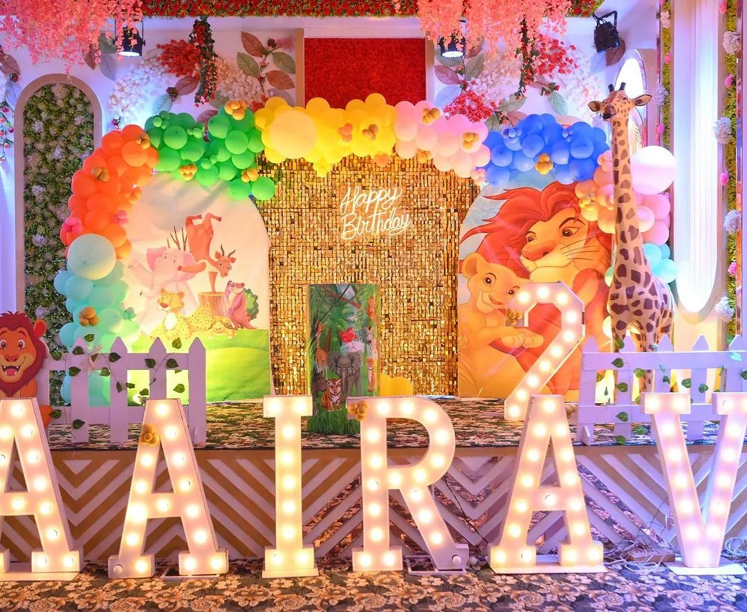We bring the jungle to your party with our vibrant and detailed safari themes. This setup includes a stunning gold shimmer wall, custom character cutouts from The Lion King, large marquee letters, and a colorful balloon arch, creating an immersive experience for your child's celebration.