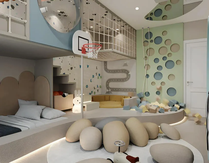 We turned this room into an indoor playground with a netted loft area, a mini basketball hoop, and a soft ball pit. The design proves that even with a bed and storage, there's always room for fun.