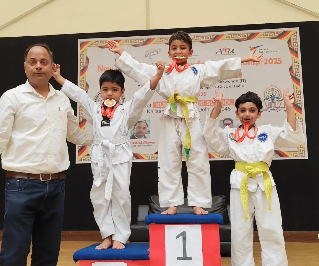 The joy of achievement is a powerful motivator. Here, our young students celebrate their victories at the New Delhi District Taekwondo Championship. We don't just teach techniques; we build the confidence to compete and the resilience to win.