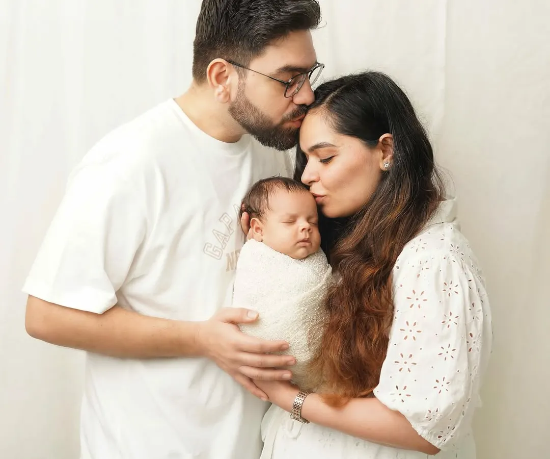 A family portrait is more than just a picture; it's the feeling of being whole. I love capturing these moments of pure connection, where mom and dad are wrapped up in the magic of their new baby. These light and airy family photos are perfect for remembering the beginning of your story.