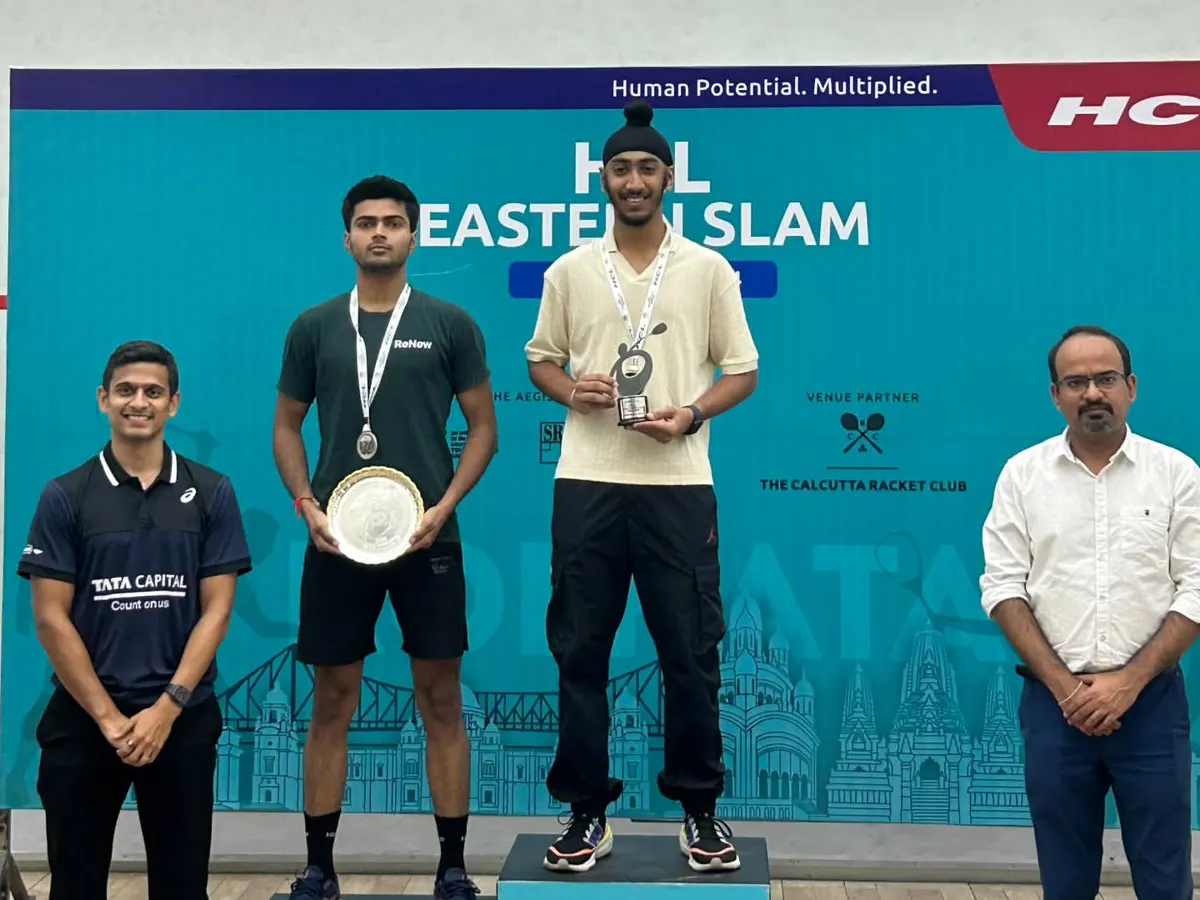 This is what we work for. One of my players on the podium at the HCL Eastern Slam in Kolkata, with me right there beside him. We don't just coach; we build champions and celebrate their success together.