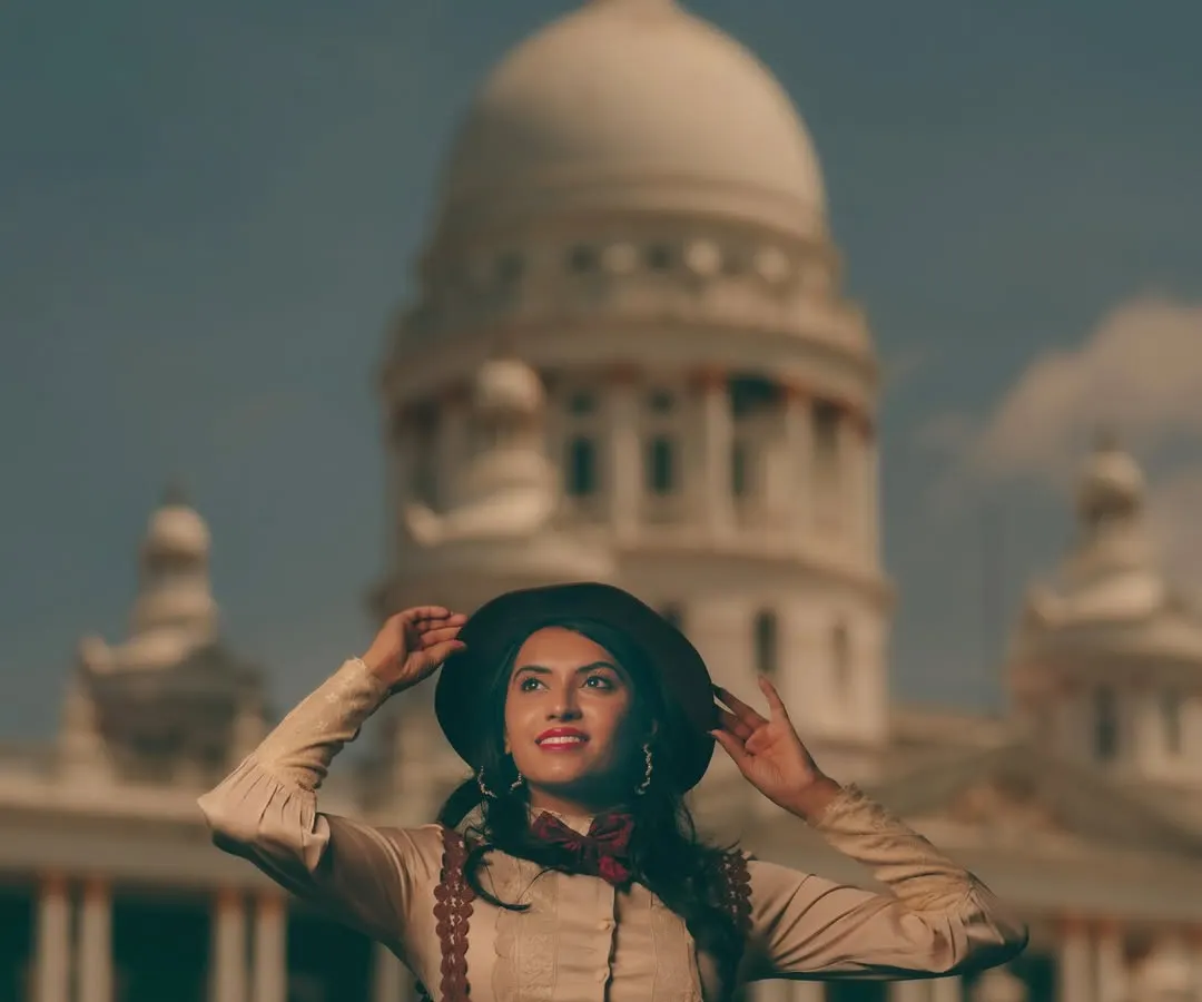 We love using the stunning architecture of Mysore as a backdrop for our fashion and portfolio shoots. This image, part of a vintage-themed series, shows how we blend location, styling, and a model's presence to create compelling, editorial-quality photographs for a professional portfolio.
