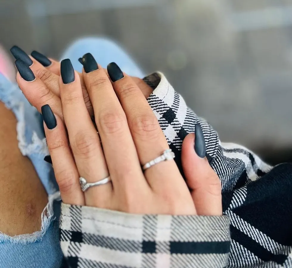 You can never go wrong with a bold, chic look. These long, square-shaped nails with a flawless matte black finish are perfect for making a sophisticated statement.