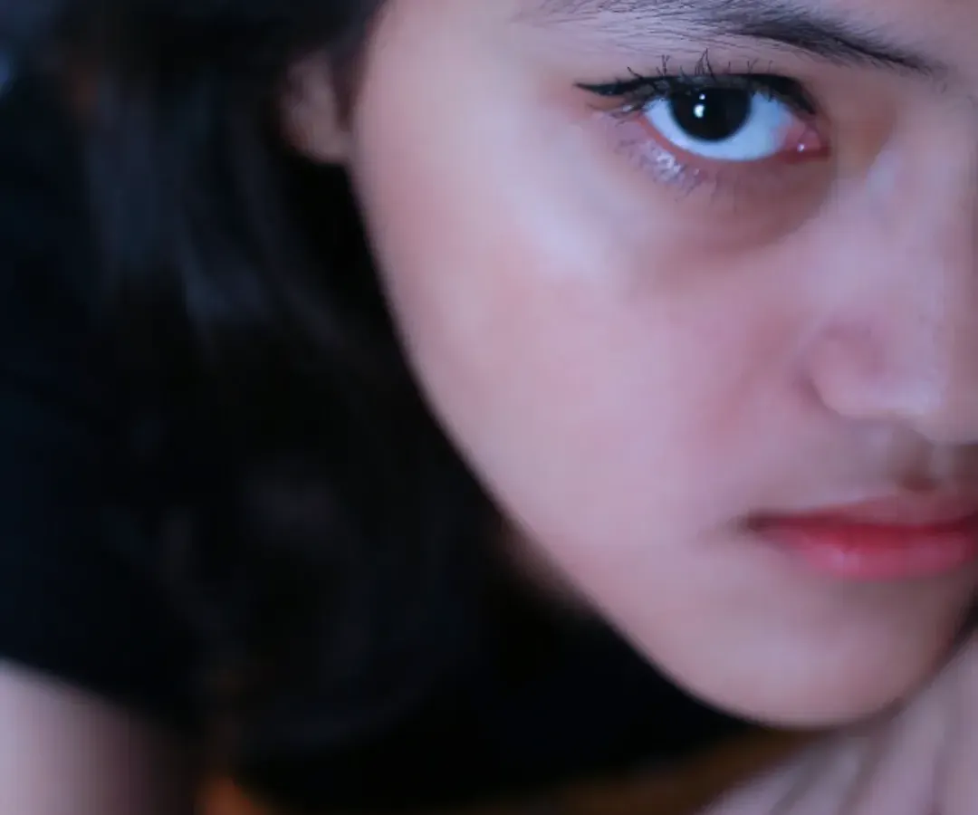 This is what I mean by capturing moods. This intense, close-up portrait from a teenage photoshoot reveals a story in her eyes. I create a comfortable space where teens can be themselves, allowing me to capture their true personality, whether it's quiet, bold, or somewhere in between.