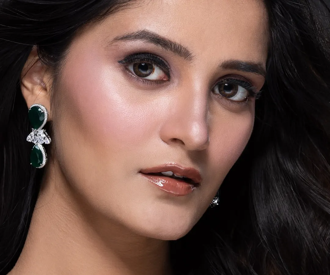 A close-up beauty portrait for a pageant portfolio, focusing on flawless makeup and a confident expression. This shot is perfect for anyone needing a powerful and professional headshot.