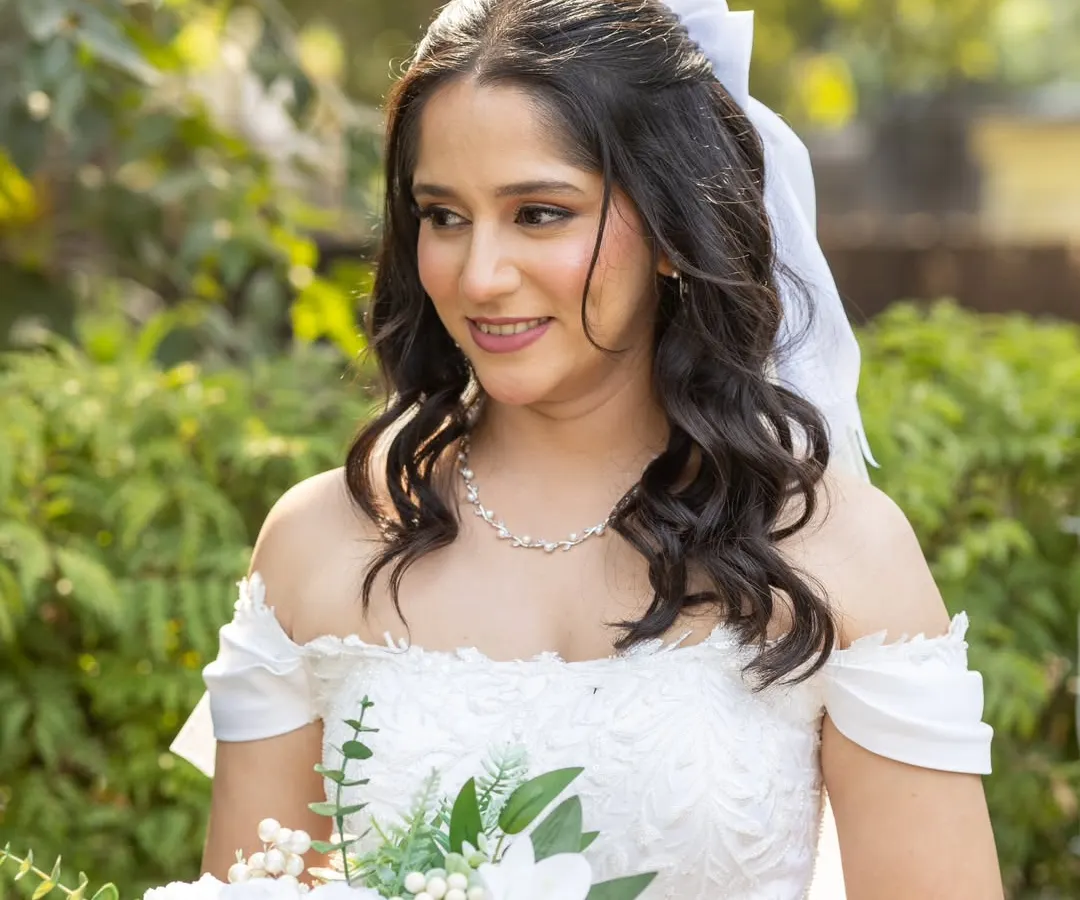 This is the essence of a classic Christian wedding look. I created a soft, natural glam that enhances her features without overpowering them, paired with gentle waves and a simple veil for a timeless and elegant bridal portrait.