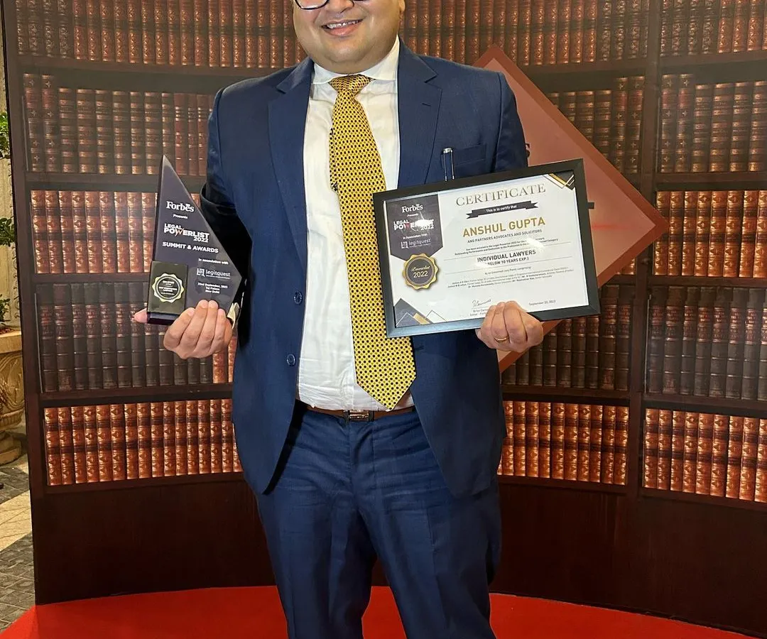 I am holding the certificate and trophy after being named in the Forbes India Top 100 Lawyers Legal Powerlist. This recognition is a testament to the successful outcomes we have achieved for our clients in complex legal battles.
