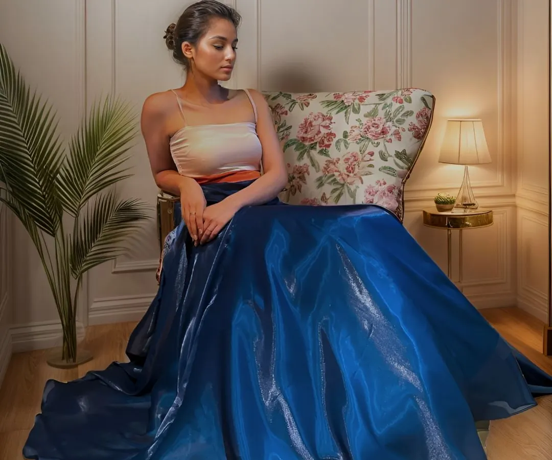 Step into the enchanting twilight with this ethereal evening cocktail dress. Fashioned from delicate glass organza and satin, its flowing silhouette moves gracefully, a perfect symphony for your magical moments.