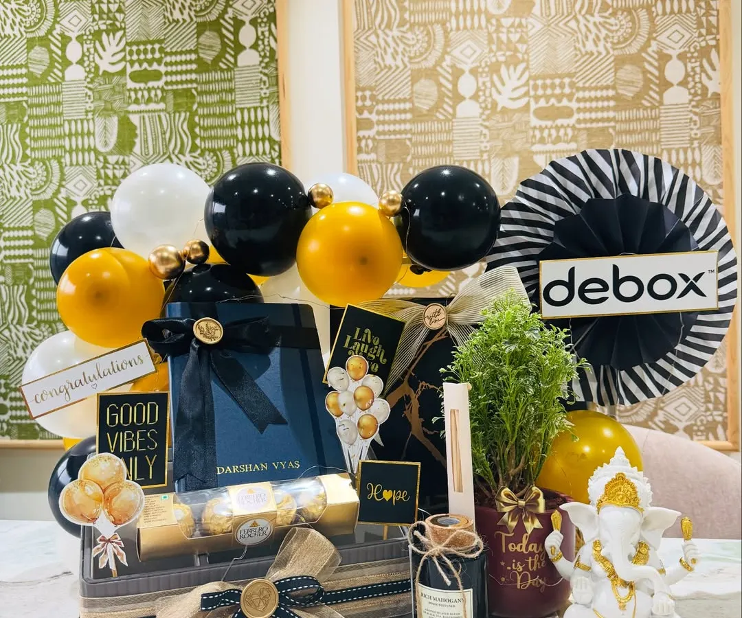 We curated this bold black and gold themed hamper for a new office inauguration. It sets a tone of confidence and prosperity with a Ganesha idol for blessings, a live plant for growth, a personalized diary for new ideas, and the company's logo for a bespoke corporate touch.