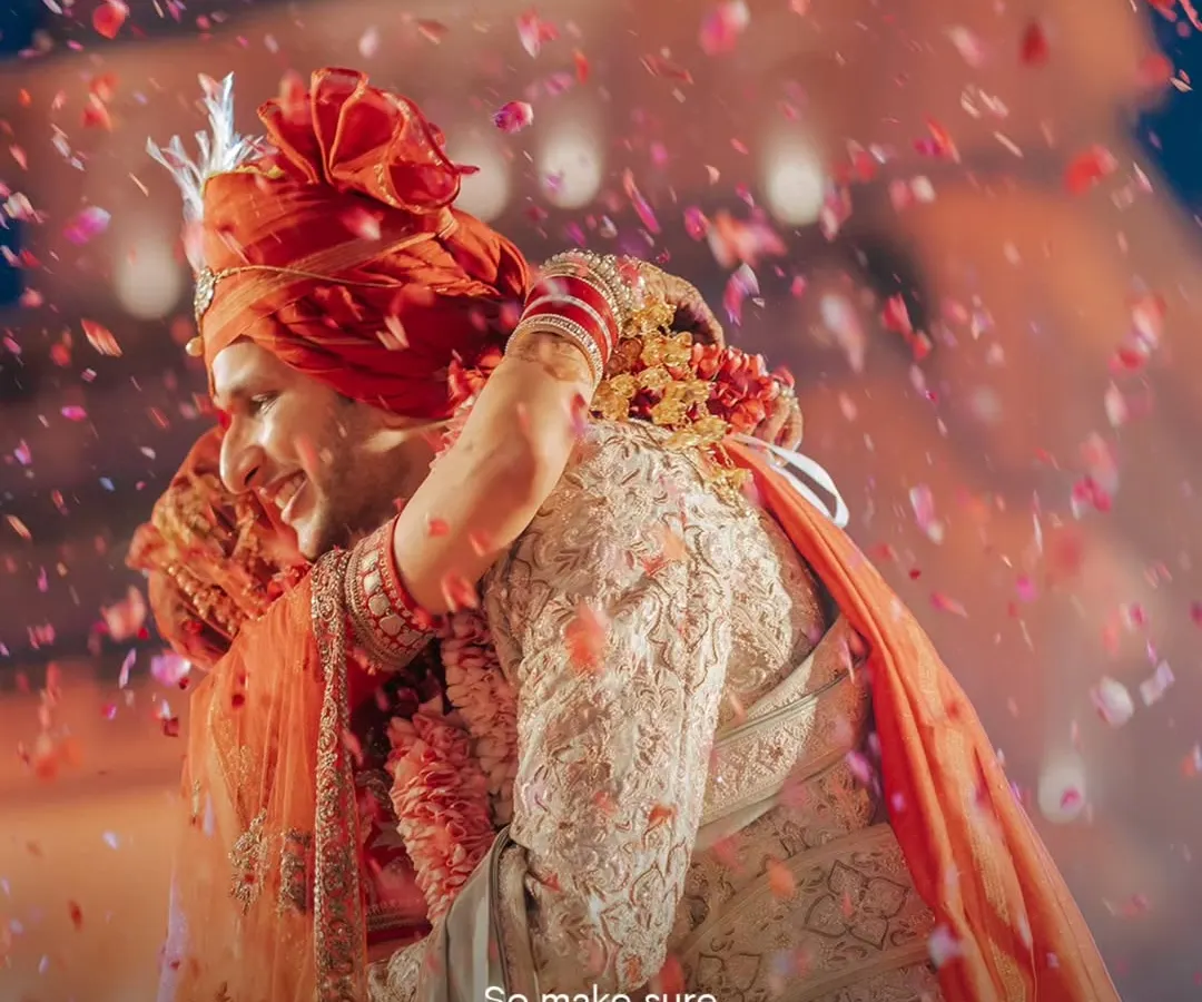 Beyond the grandeur and the decor, a wedding is about pure, unscripted emotion. This embrace, showered in petals, is the kind of timeless memory we strive to create for every couple.