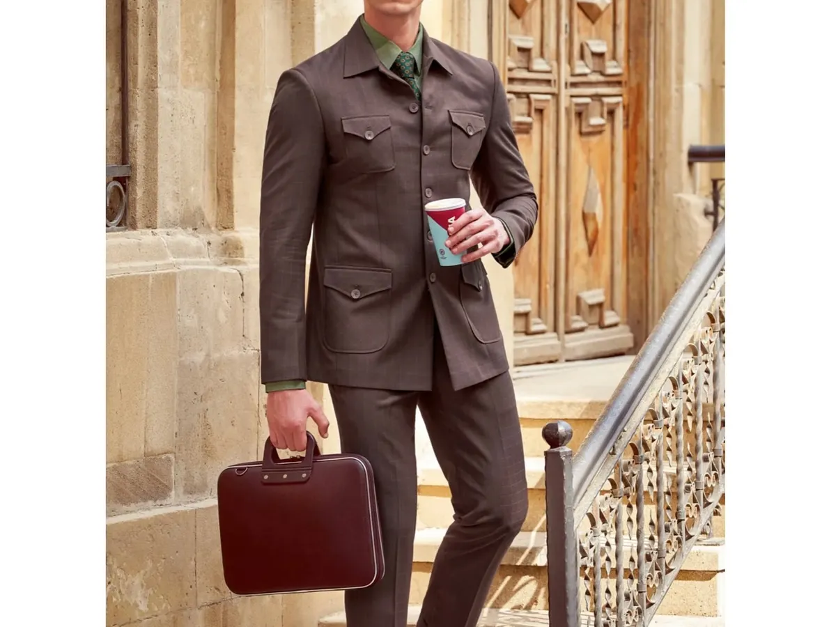This look for Only Vimal showcases my approach to modern corporate styling. I paired a classic brown pinstripe suit with a contrasting green shirt and patterned tie to create a look that is both professional and distinctive.