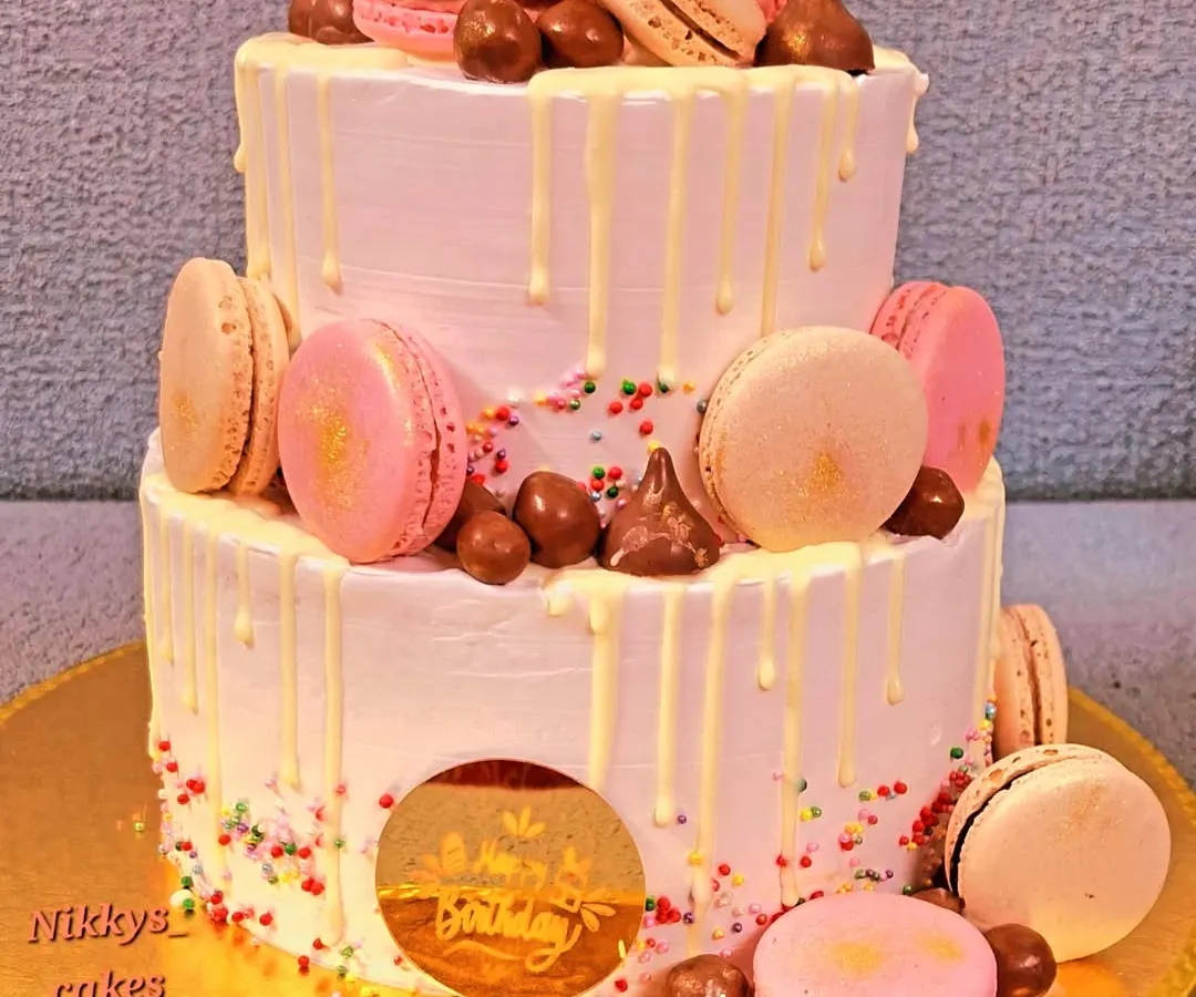 For a touch of elegance, I created this two-tier birthday cake decorated with delicate macarons and a white chocolate drip. It's a perfect choice for milestone birthdays, corporate events, or any celebration that calls for a sophisticated dessert.