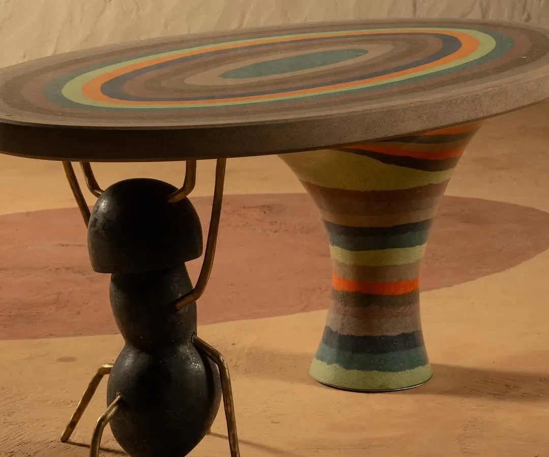 Inspired by the colorful mountains of Argentina and nature's tiny architects, the Weavers' Ant table is a piece of art. The tabletop features hand-poured pigments, and the entire structure is a testament to balancing playful design with serious craftsmanship.