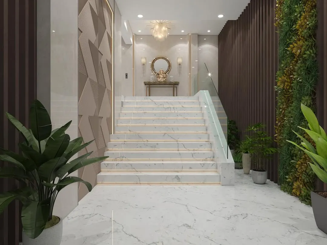For this lobby in Nerul, we designed a grand marble staircase with a minimalist glass railing to create an open and impressive entryway. The combination of textured wall panels, ambient lighting, and integrated planters demonstrates our skill in creating layered, sophisticated commercial spaces.