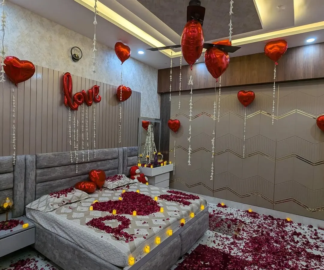 For a classic romantic surprise, I use a combination of heart-shaped foil balloons, rose petals, and safe LED candles. This setup is perfect for anniversaries, birthdays, or just to show someone how much you care.