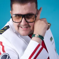 Dressed for the occasion in a custom white jacket. My look is part of the performance, projecting confidence and a larger-than-life persona that matches the energy of my music.