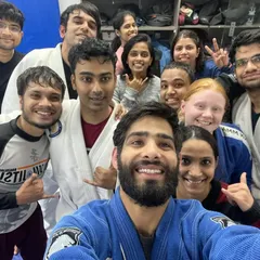 A great mix of students in their Gis, ready to learn and apply new techniques.