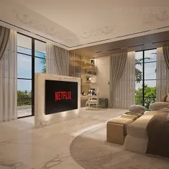 The custom-designed TV unit in this bedroom stands as a monolith of marble, elegantly dividing the space. The floor-to-ceiling windows are dressed with heavy curtains, allowing for complete light control.