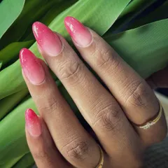 A dreamy ombré blend of nude and coral red, finished with a shimmer top coat for extra sparkle. The gradient is soft and seamless, creating a warm and elegant look that glows.