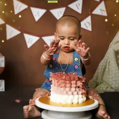 Look at my hands. This little one is showing off his messy hands after having a great time with his birthday cake.