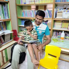 Some of the most precious moments in our library are when we see families reading together. A father and son sharing a story is a beautiful reminder that reading builds bonds that last a lifetime. We encourage all parents to find a cozy corner and create these special memories with their children.