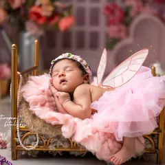 The magic of new life is captured in this enchanting butterfly-themed newborn shoot. We style every detail, from the delicate wings to the floral setting, to turn your baby's first portraits into a fairytale.