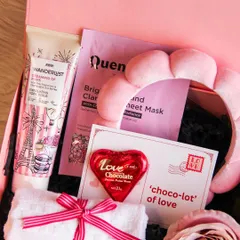 The 'Love & Glow' spa-themed hamper is perfect for a Galentine's gift or for pampering your partner. It includes face masks, scrubs, a spa headband, and chocolate.
