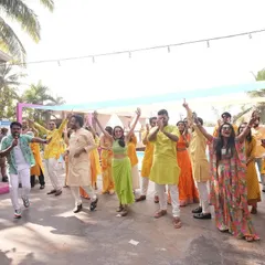 Leading the dance moves at a poolside party. My job is to get everyone on their feet and enjoying the celebration under the sun.