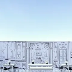 A wide shot of the 2D theme setup against a clear blue sky, showcasing the impressive scale and artistic detail of the custom-drawn backdrop.