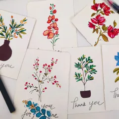 Handmade postcards are a beautiful old-school way to express your feelings. This collection features various floral illustrations, perfect for thank you notes or sending a message to someone special.