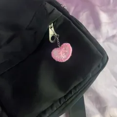 A closer look at the pink heart keychain. You can see the handmade stitches and the little chain I use to attach it.
