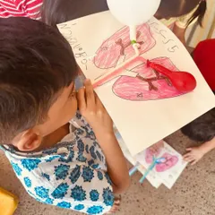 A child uses a balloon and straw model to simulate breathing. This hands-on activity helped our learners visualize and understand the function of the lungs in a tangible, memorable way.