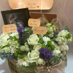 A clear shot of the 'Happy Birthday Papa' hamper, showcasing the beautiful combination of spiritual elements and fresh blooms.