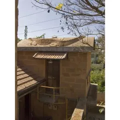 The "Prof's Residence" in Bengaluru, an early experimental project from 2003. It featured a universally accessible ground floor and a crocodile sculpture on its vaulted roof, serving as a laboratory for many of our design ideas.