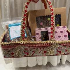 This is another one of our festive gift baskets, in a traditional red design. We offer both healthy and indulgent options to fit every budget and preference.